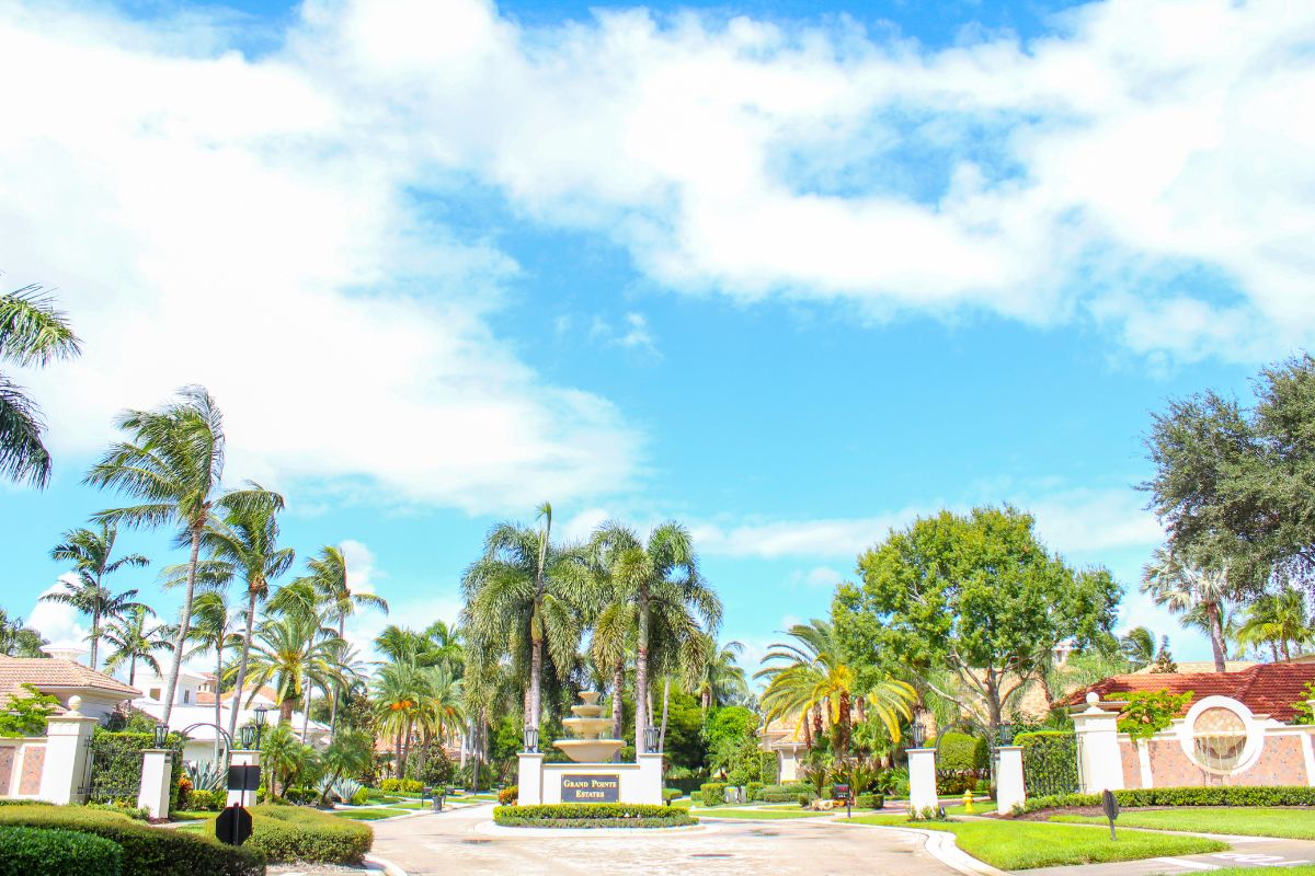 The entrance of a South Florida neighborhood maintained by Sherlock Tree Company.